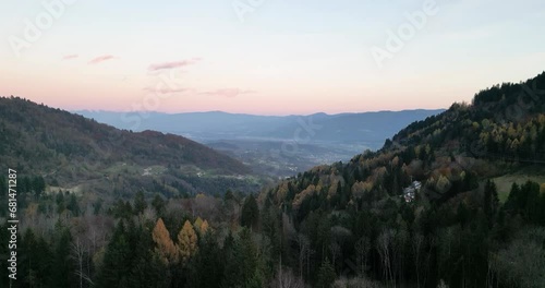 Aerial panorama of Pedavena forest.
Dolomites in the distance, autumn foliage photo