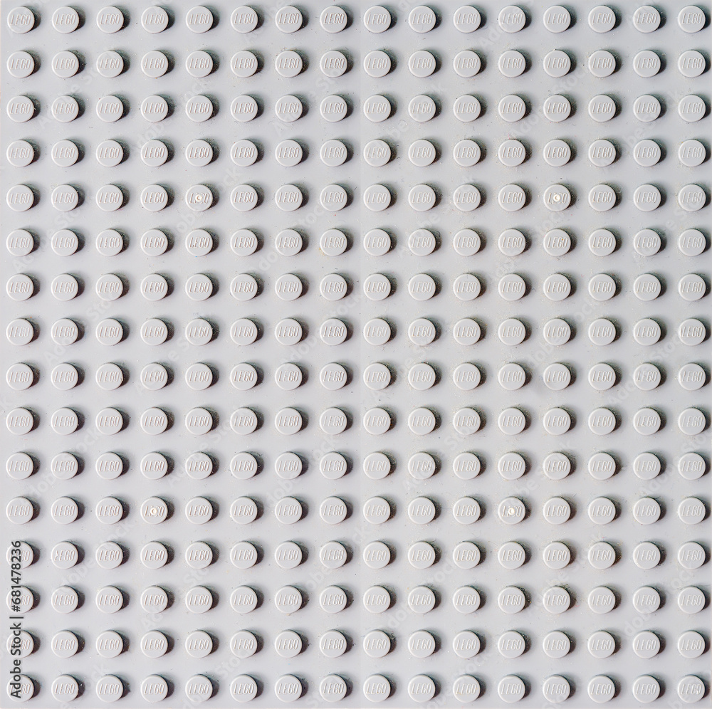 Fototapeta premium Gray Building Blocks Background: Creative Construction Toy Display. Lego blocks. Novosibirsk, Russia - October 26, 2023.