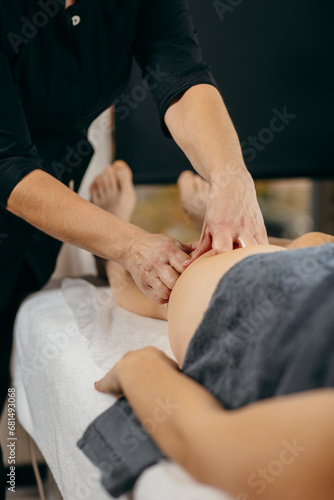 Female hands doing leg massage