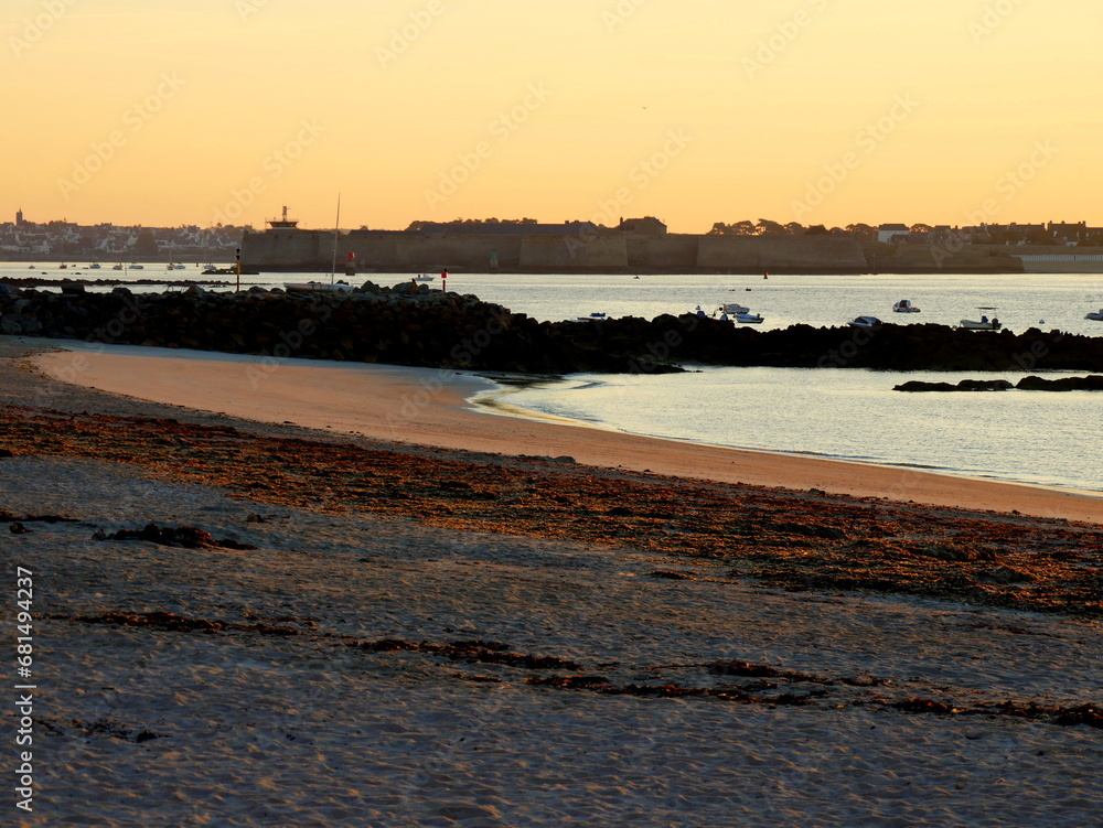 Port Louis fortress seen from Larmor Plage beach in early morning light, Brittany, France