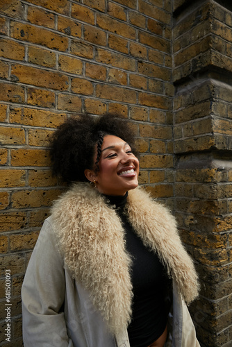 Portrait of a biracial girl with curly afro hair and a tooth gem, wearing a furry coat. Concept of gen z, fashion and self expression