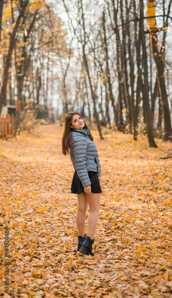 Rear view portrait of diversity young beautiful confident Indian Asian woman in fall outdoor. Happy and natural smiling female. Generation z and gen z youth concept Rear view portrait of diversity young beautiful confident Indian Asian woman in fall outdoor. Happy and natural smiling female. Generation z and gen z youth concept