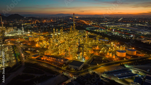 Aerial view of the morning of the oil refinery from the drone of the tower of the Petrochemistry industry in the oil    and    gas       industry with    cloud    sun orange   