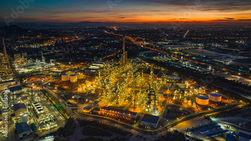 Aerial view of the morning of the oil refinery from the drone of the tower of the Petrochemistry industry in the oil    and    gas       industry with    cloud    sun orange   