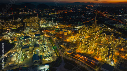 Aerial view of the morning of the oil refinery from the drone of the tower of the Petrochemistry industry in the oil    and    gas       industry with    cloud    sun orange   