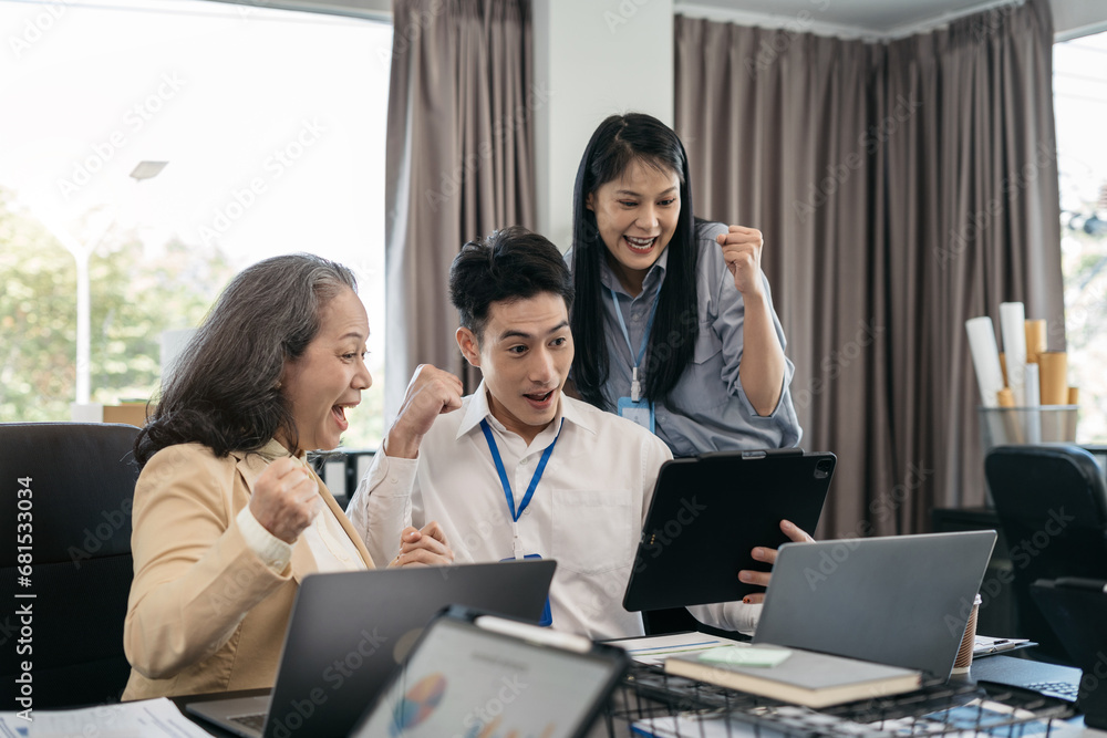 Happy smiling businessman feel happy work complete Teamwork success, success at work in the office concept. Happy smiling businessman feel happy work complete Teamwork success, success at work in the office concept.