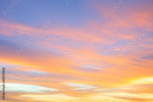 青い空に映るピンクとオレンジの雲、朝焼け・夕焼けの空が見せる素晴らしい光景、新たな一日への期待が高まる瞬間 photo