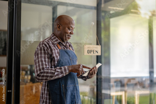 Canvastavla A healthy retired black senior man stands proudly at his new personal business