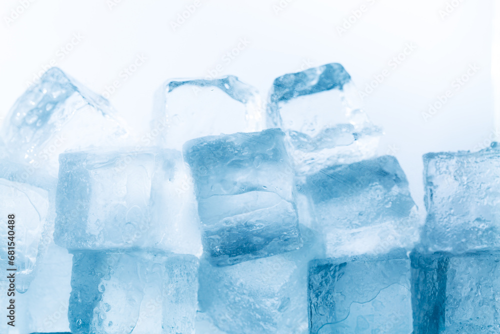 Ice cubes isolated white background,Realistic frozen ice cubes and water wave splashes, kitchen skinali panel background. Ice cubes whirl in liquid blue clear aqua wave, splatters of clean drink swirl Ice cubes isolated white background,Realistic frozen ice cubes and water wave splashes, kitchen skinali panel background. Ice cubes whirl in liquid blue clear aqua wave, splatters of clean drink swirl
