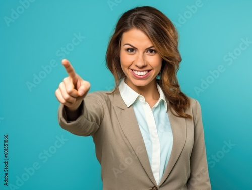 woman with sweet smile pointing pose on blue background