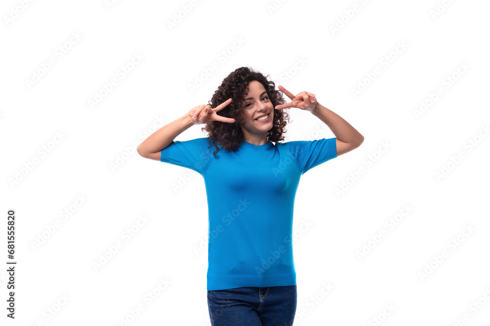 young woman with curly natural hair style dressed in a blue sweater young woman with curly natural hair style dressed in a blue sweater