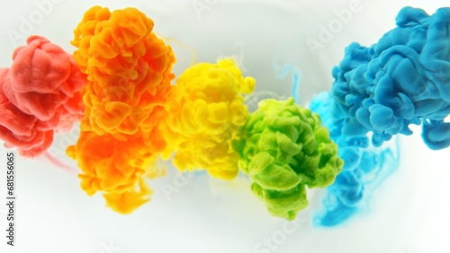Colorful Inks Mixing in Water, Isolated on White Background.