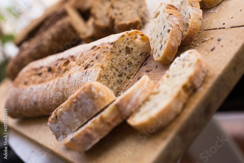 Fresh loaf of bread on wooden board