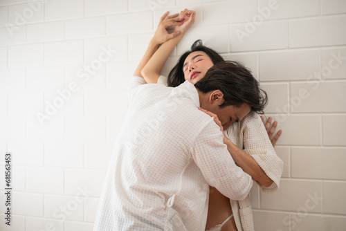Fotografia, Obraz Asian young couple in underwear having sex in bedroom.