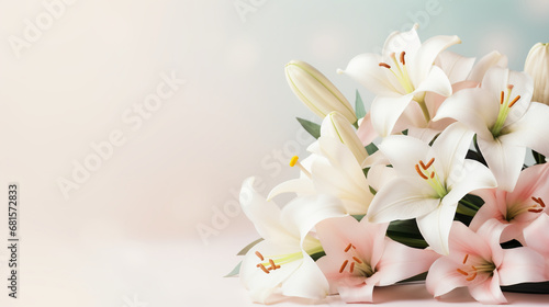 Photographie Easter lillies and colorful decorated easter eggs on a light pastel background