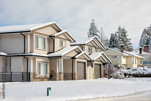 Residential duplex house in snow on winter day in Coquitlam, BC, Canada