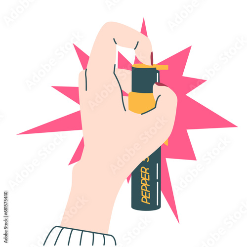 Woman's hand holding and using pepper spray