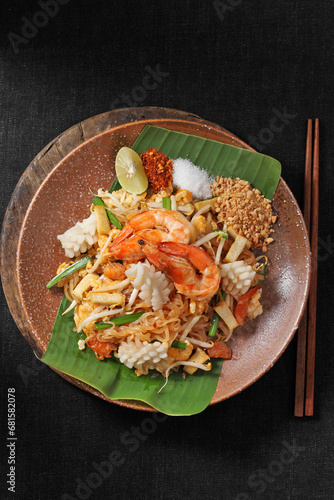 Pad Thai popular street food on a dark background and copy space.