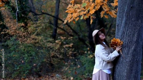 Stylish woman enjoying autumn weather outdoor. Fashion, style concept. People, lifestyle, relaxation and vacations concept.