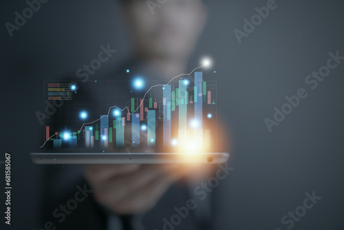 businessman typing and using on laptop holographic in the office workplace planing in work progress about investment and money management ,trading chart financial investment money management concept