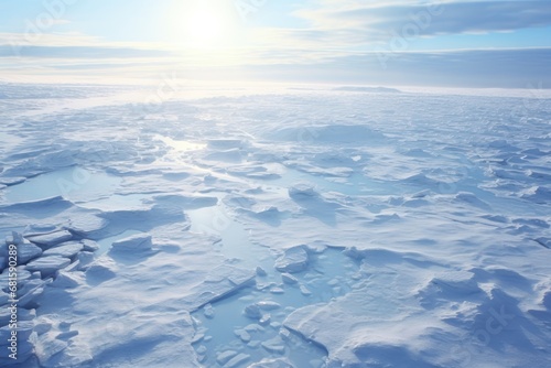  the sun shines brightly over a vast expanse of ice and snow in the middle of a vast expanse of flat expanses of snow covered with ice and snow.