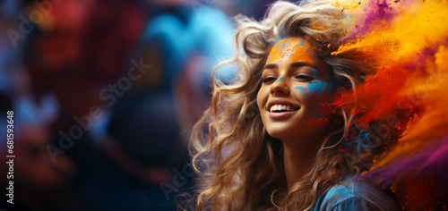 girl sprinkles colored powder on another during the Holi festival. Swirls of small particles are visible throughout the frame, a copy of the space creating an atmosphere of fun and festive delight