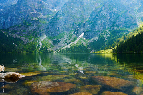 Mountains range near lake at summer day