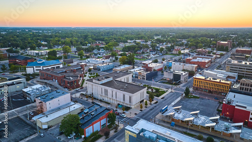 Muncie Indiana downtown aerial buildings with central courthouse and golden yellow dawn © Nicholas J. Klein