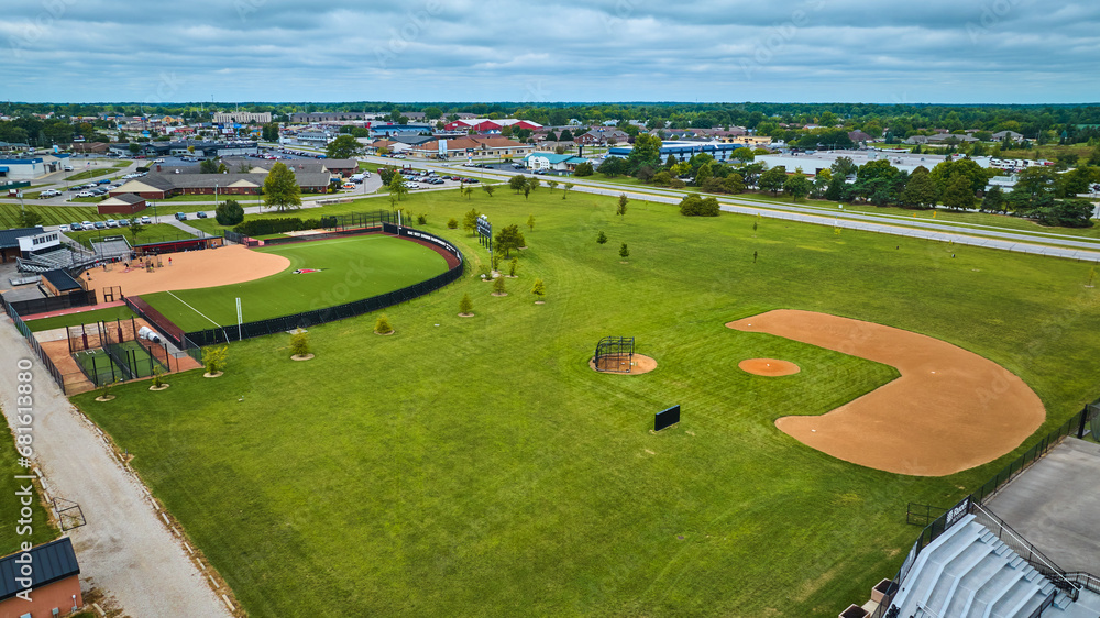 Varsity Softball Complex aerial with players practicing on field and distant buildings, Muncie, IN Varsity Softball Complex aerial with players practicing on field and distant buildings, Muncie, IN