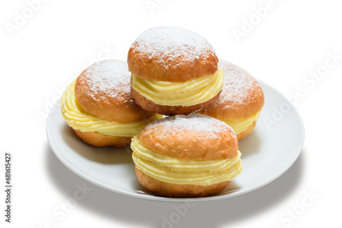 Fotografie three bakery dreams on a white plate against