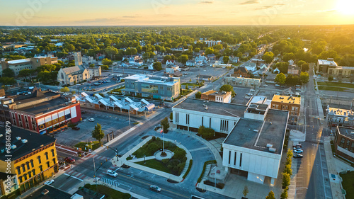Courthouse, Muncie, IN at sunset with golden sun setting in aerial of downtown buildings
