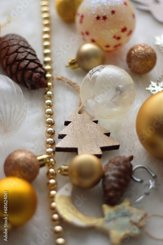 Various colorful Christmas oranments and white faux fur blanket. Selective focus. photo