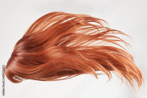 Natural looking shiny hair, red curls isolated on white background with copy space