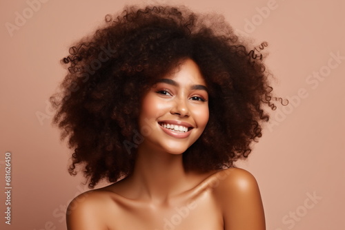 Beauty portrait of african american woman, curly long hair, natural girl makeup. Happy smile