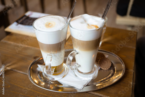 Photography Morning coffee break - glass of latte macchiato and wiener melange coffee