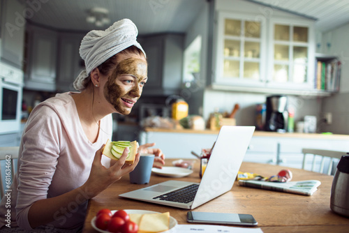 Wallpaper Mural Woman with Face Mask Checking Emails Over Breakfast Torontodigital.ca