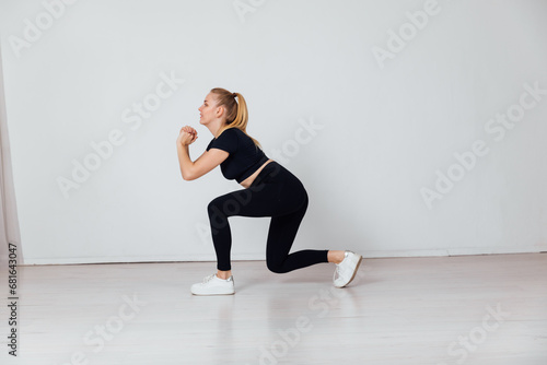 Fototapeta Naklejka Na Ścianę i Meble -  Fitness Woman Blonde Doing Gymnastics Strength Sport