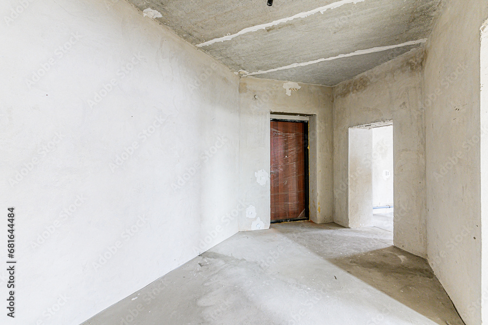 interior apartment rough repair for self-finishing. interior decoration, bare walls of the room, stage of construction interior apartment rough repair for self-finishing. interior decoration, bare walls of the room, stage of construction