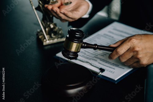 Business and lawyers discussing contract papers with brass scale on desk in office. Law, legal services, advice, justice and law concept picture with film grain effect