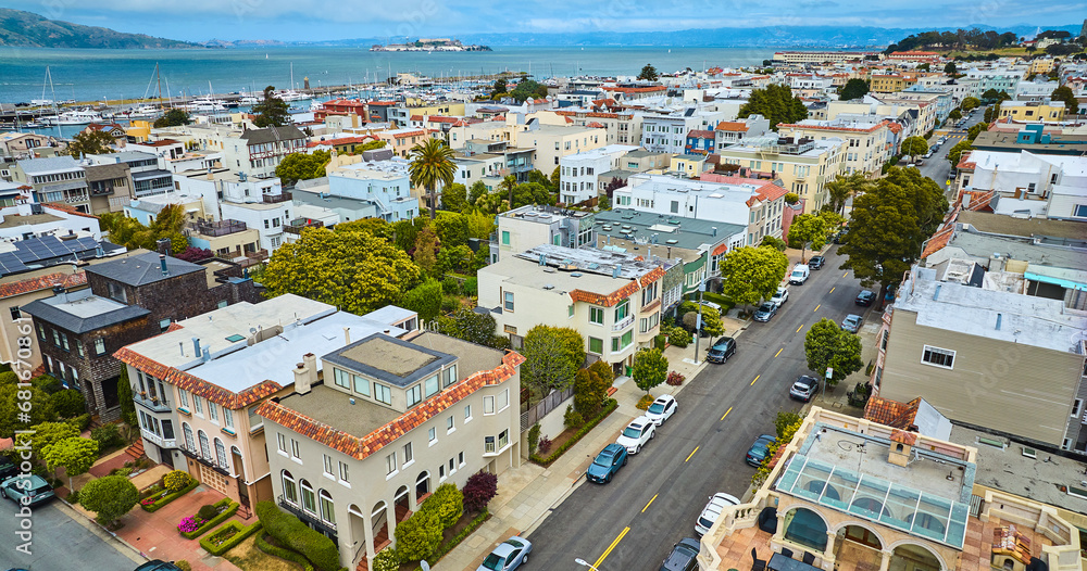 Residential housing and apartments separated by road in aerial San Francisco with Alcatraz Island, CA