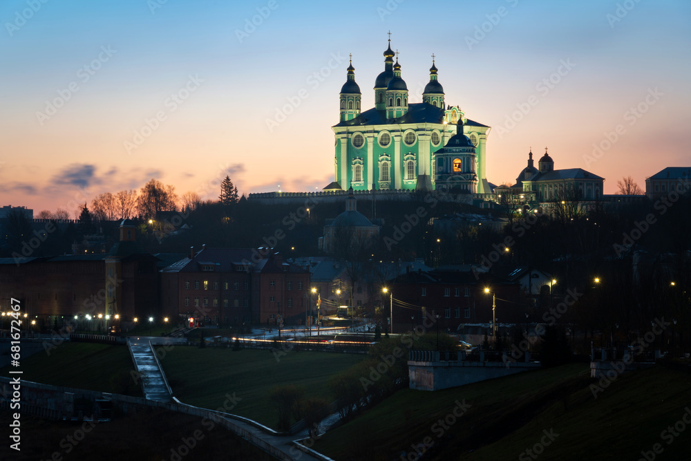 View of the embankment of the Dnieper River in Smolensk, the Assumption Cathedral and the wall of the Smolensk Fortress in the night illumination, Smolensk, Russia