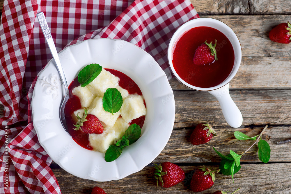 Lazy dumplings with strawberry sauce in a ceramic bowl. Lazy dumplings with strawberry sauce in a ceramic bowl.