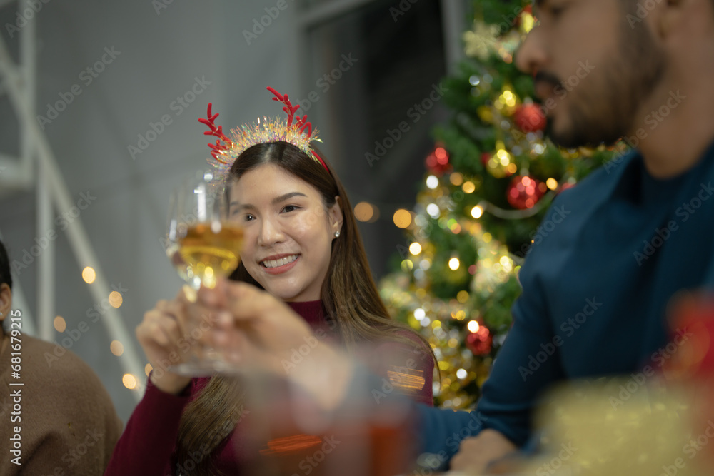 close up girl hold glasses of champagne with lighting. Dinner party with drinking of champagne. hands holding clear glass with alcohol in yellow shine reflect.