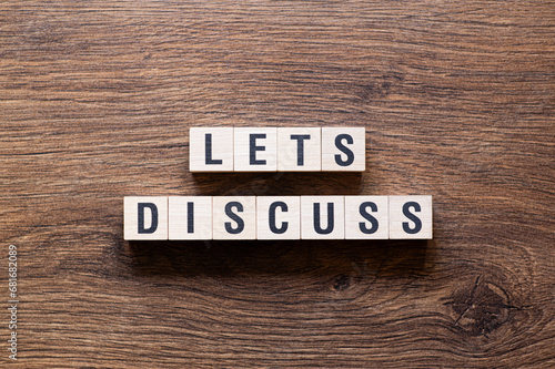 Lets discuss - word concept on building blocks, text