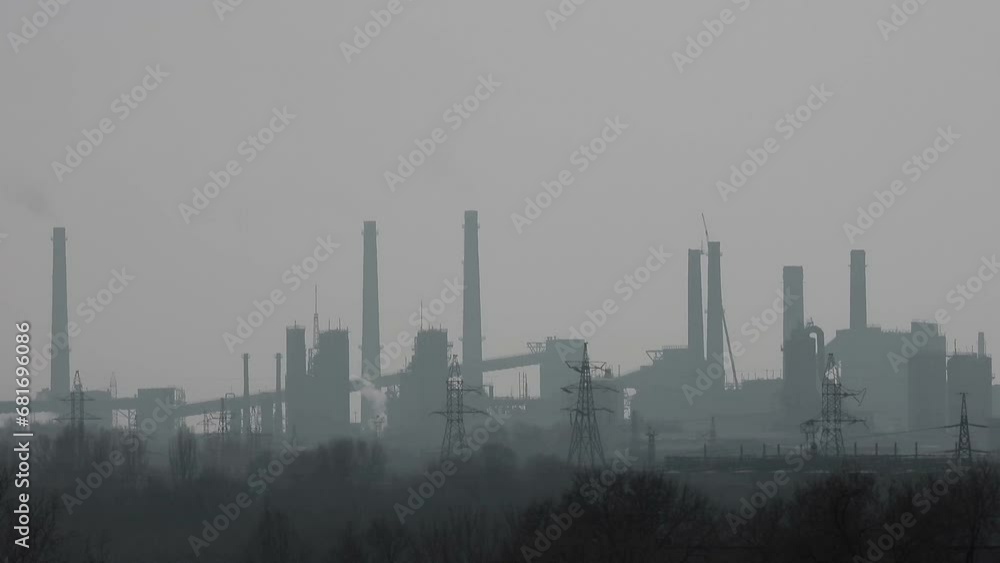 Metallurgical plant in fog traffic. Industrial landscape. Heavy metallurgy background. Exhausts of hazardous gases. Metallurgical plant in fog traffic. Industrial landscape. Heavy metallurgy background. Exhausts of hazardous gases.