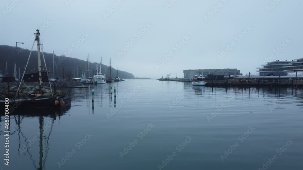 Low-Flying Drone Passing Over Misty Harbour Low-Flying Drone Passing Over Misty Harbour
