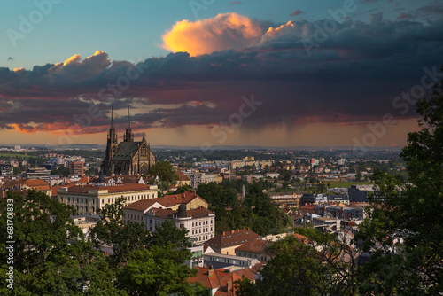 View of the city of Brno in the Czech Republic in Europe from the Špilberk viewpoint. The dominant feature of Brno is the Cathedral of St. Peter - Petrov. There is a beautiful sky in the background..​ photo