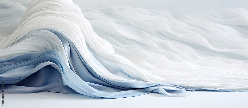 Obraz premium In their exquisite abstract design for a winter wedding, the fashion designer used a beautiful combination of white, silver, and blue colors, creating a stunning wave-like texture on the fabric that