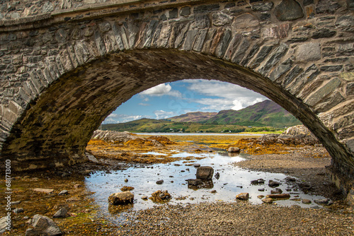old arch bridge over the river