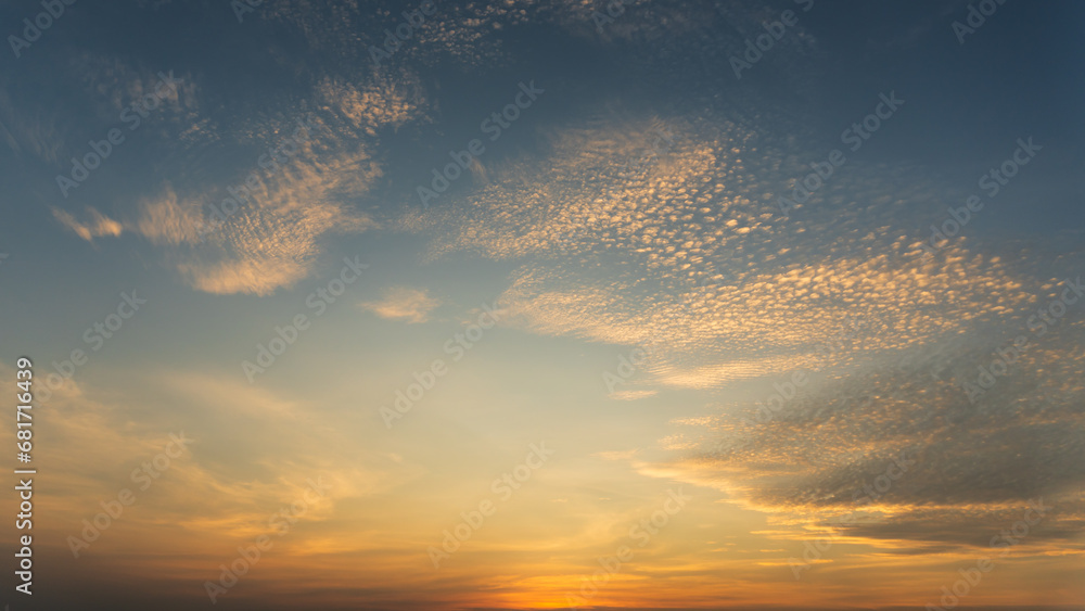 Fototapeta premium Background of colorful sky, Dramatic sunset with twilight color sky and clouds.